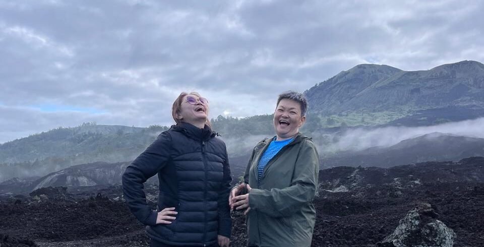 Mount Batur sunrise and black lava