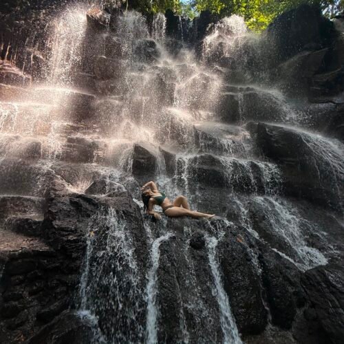 Tegenungan Waterfall surrounded by tropical greenery